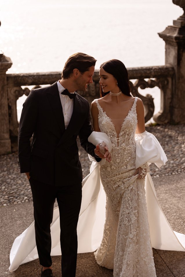 New arrival designer wedding dress with lace details and a sculpted bridal silhouette.