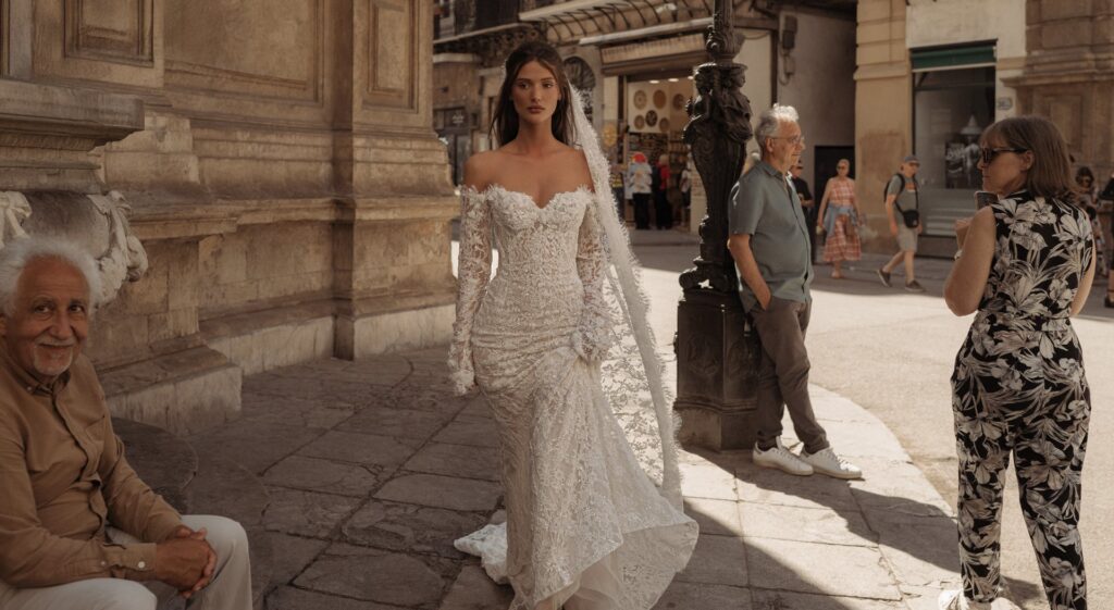 New arrival luxury wedding dress featuring a strapless corset bodice, delicate lace appliqués, and a flowing bridal skirt with elegant couture details.